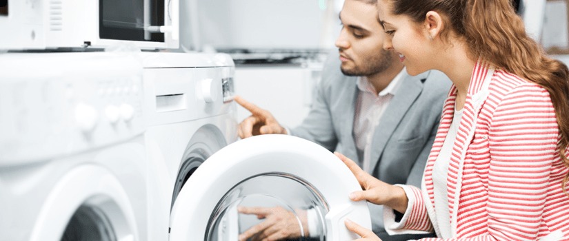 Banner Image of a Young Couple Choosing Which Washing Machine to Buy