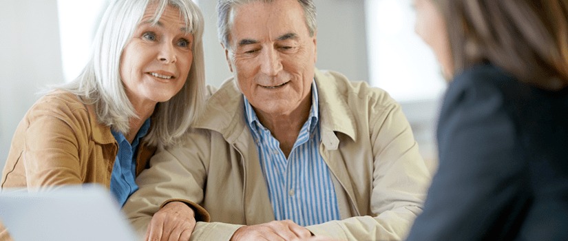 Banner Image of a Senior Couple Talking to a Financial Adviser