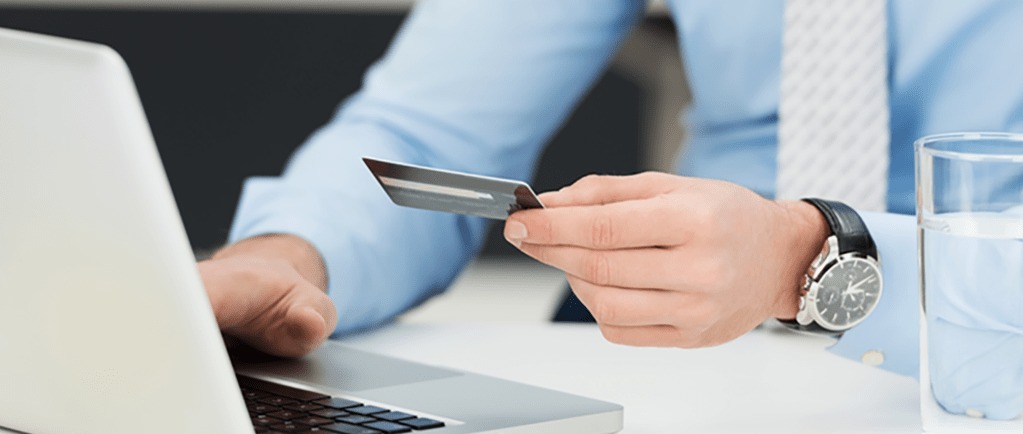 Banner Image of a Businessman Using a Credit Card for an Online Purchase