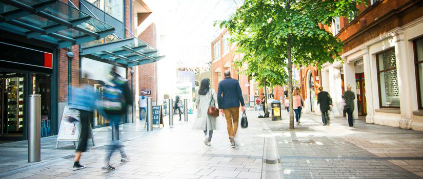 Banner Image of a Couple Walking Through a Town Centre High Street