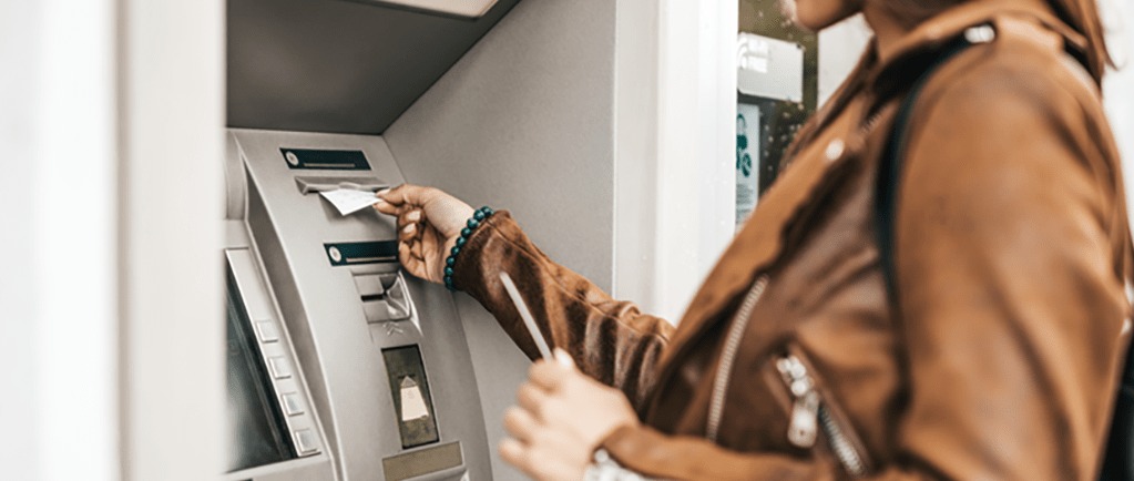 Banner Image of a Young Woman Using a Cashpoint